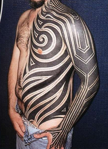 Blackwork half of body tribal tattoo