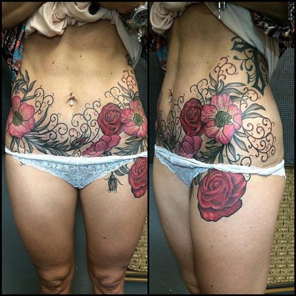 Pink Belly Flowers tattoo by Last Angels Tattoo