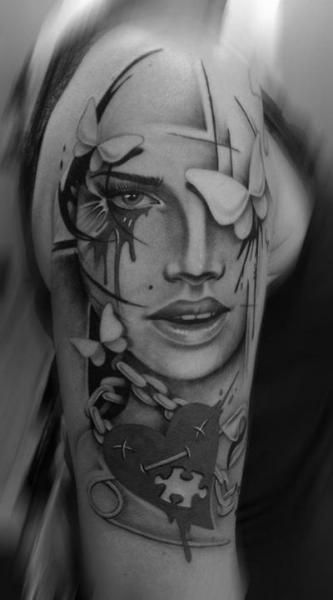 Puzzle Heart Face Realistic tattoo by Westfall Tattoo