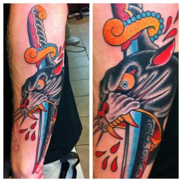 Dagger Stabbed Panther Old School tattoo on Arm by Three Kings Tattoo
