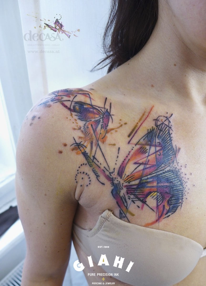 Flying Butterflies tattoo on Chest and Shoulder by Carola Deutsch