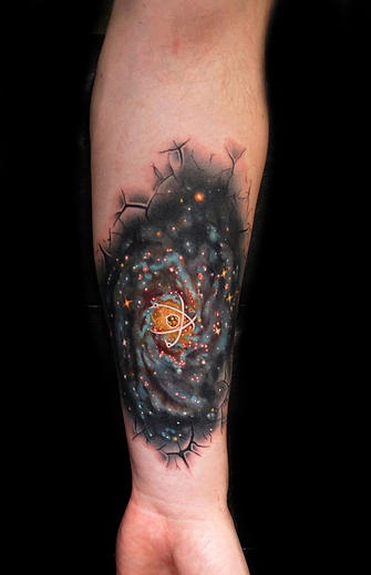 In Shkin Atom Galaxy tattoo by Andres Acosta