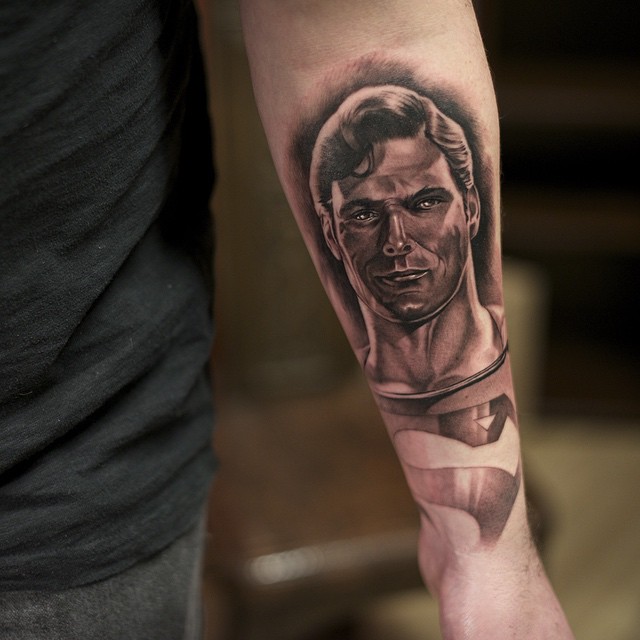 Graphic Arm Superman tattoo by Charles Saucier