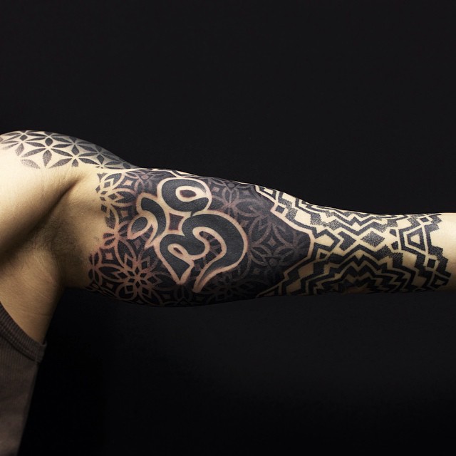 Hindu Symbol Arm tattoo