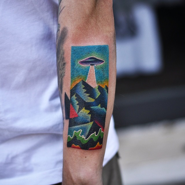 Above the Mountains UFO tattoo