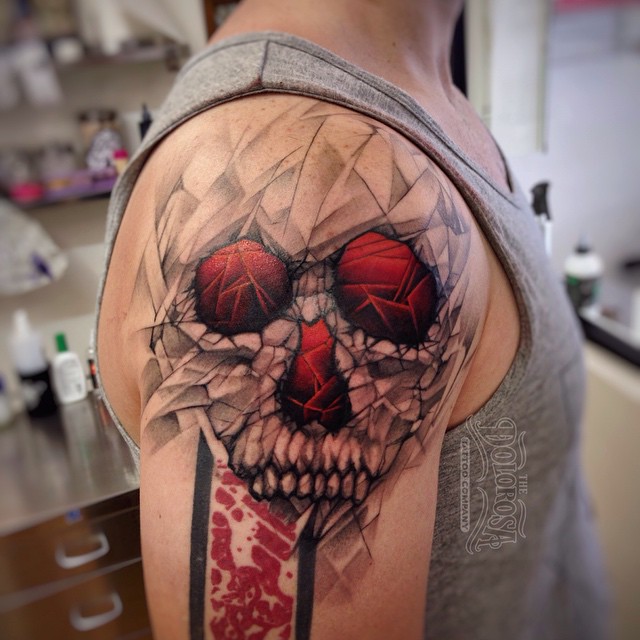 Grey and Red Skull on Shoulder