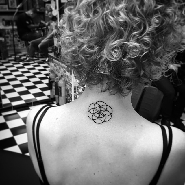 Circles on Circles Back Neck Tattoo