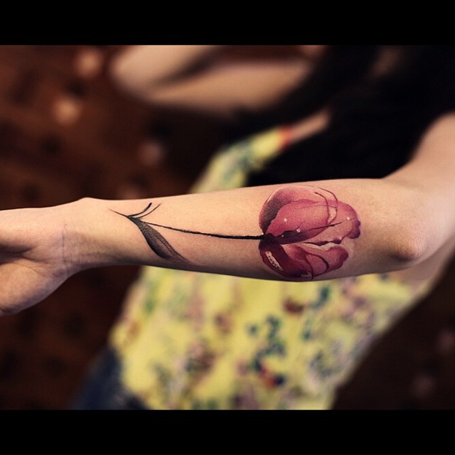 Tender Pink Flower Tattoo on Arm