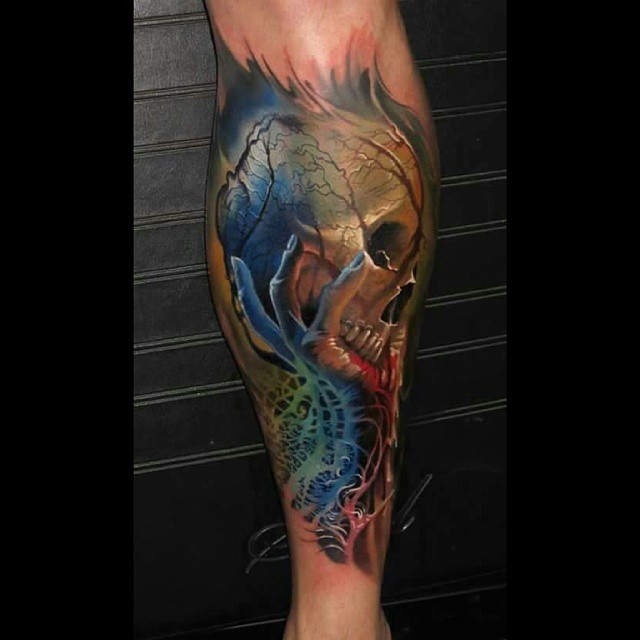 Skull in Hand Tattoo on Leg