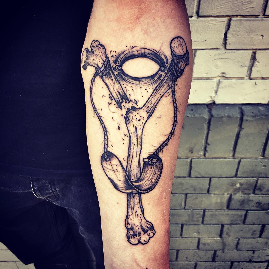 Bone Slingshot Tattoo