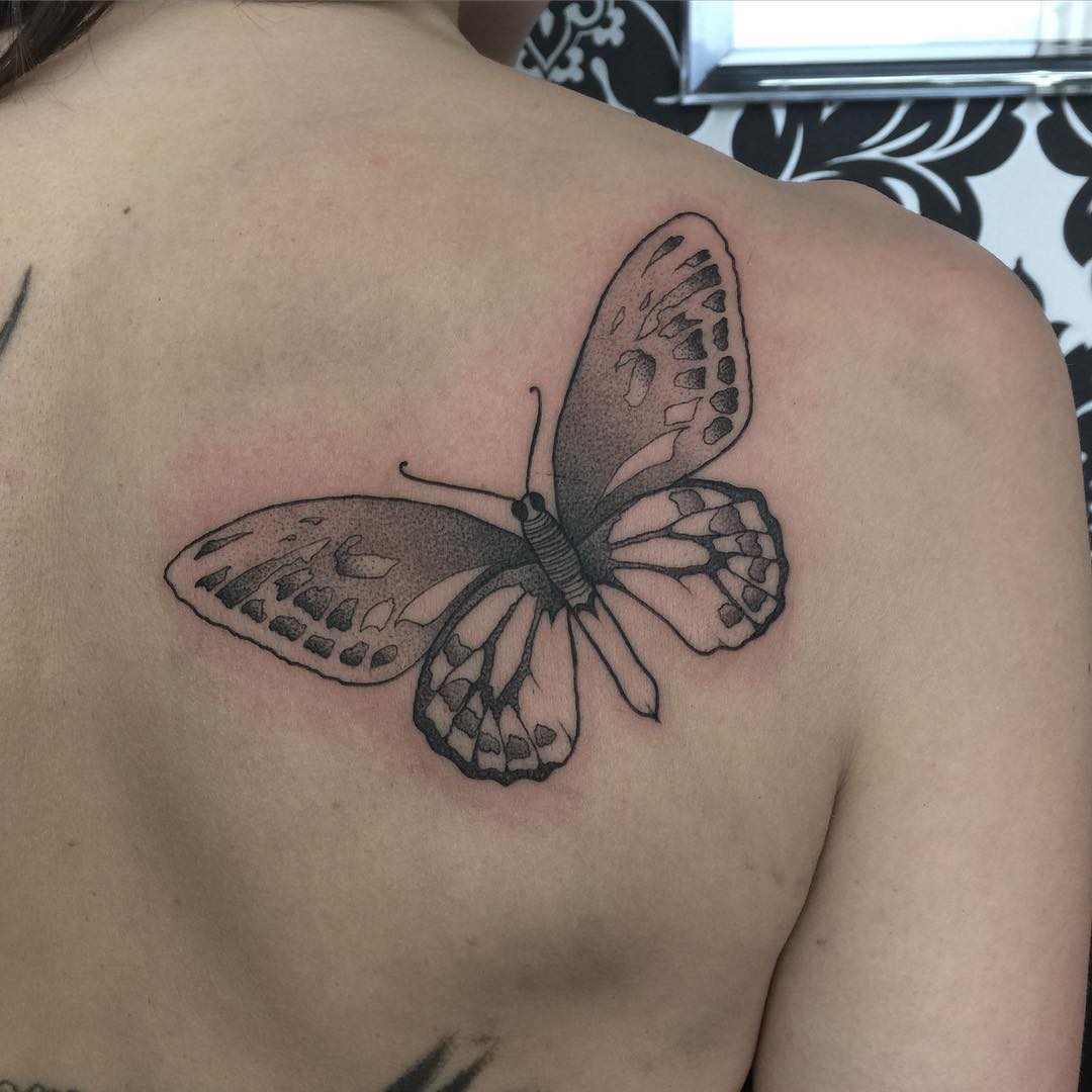 cool butterfly on the shoulder blade - black and grey tattoo