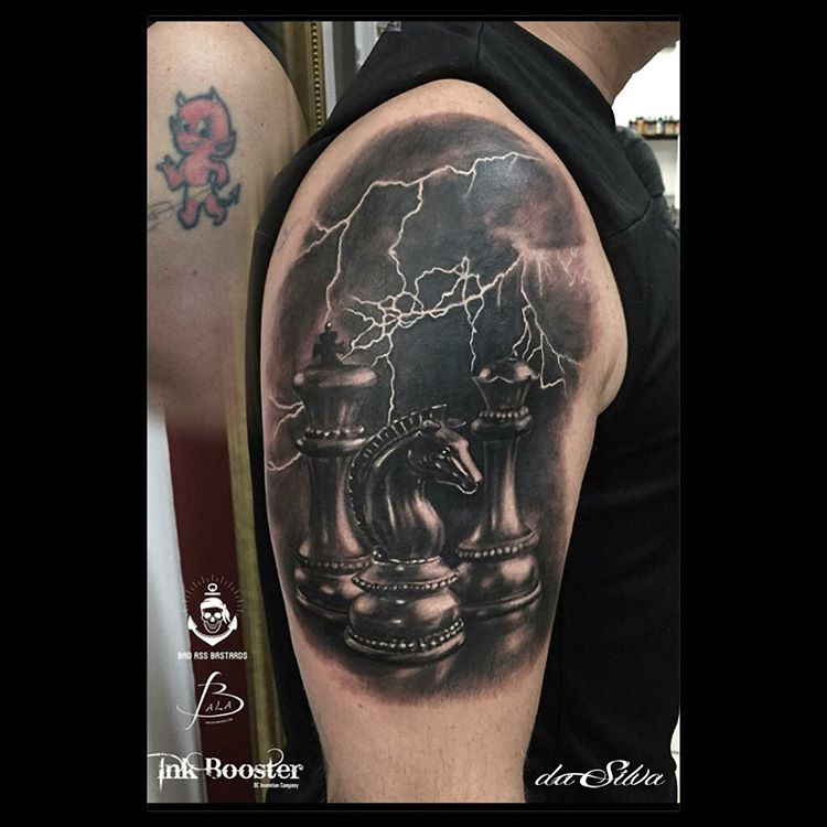 a shoulder tattoo of Chess Pieces