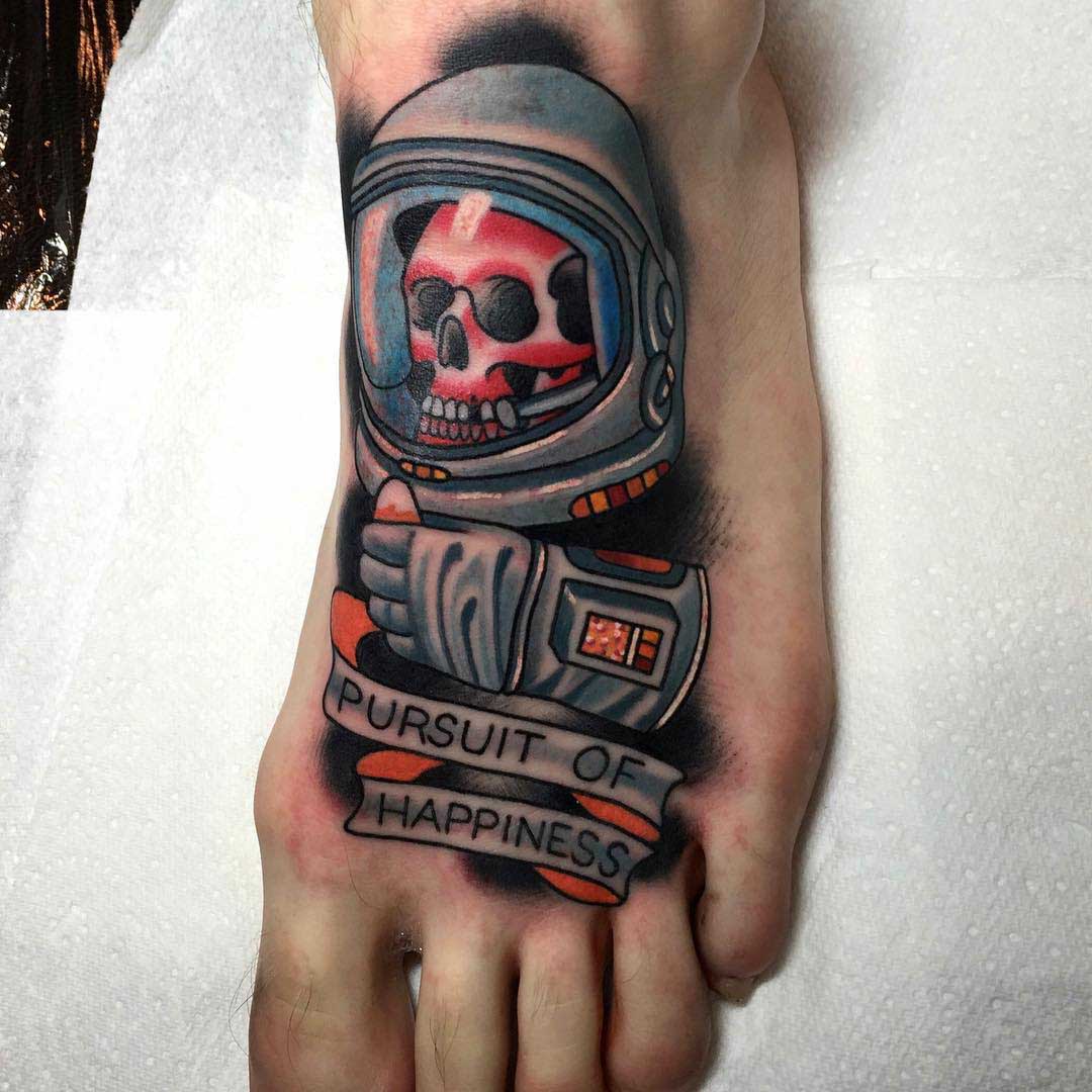 foot tattoo space skull tattoo neo-traditional style