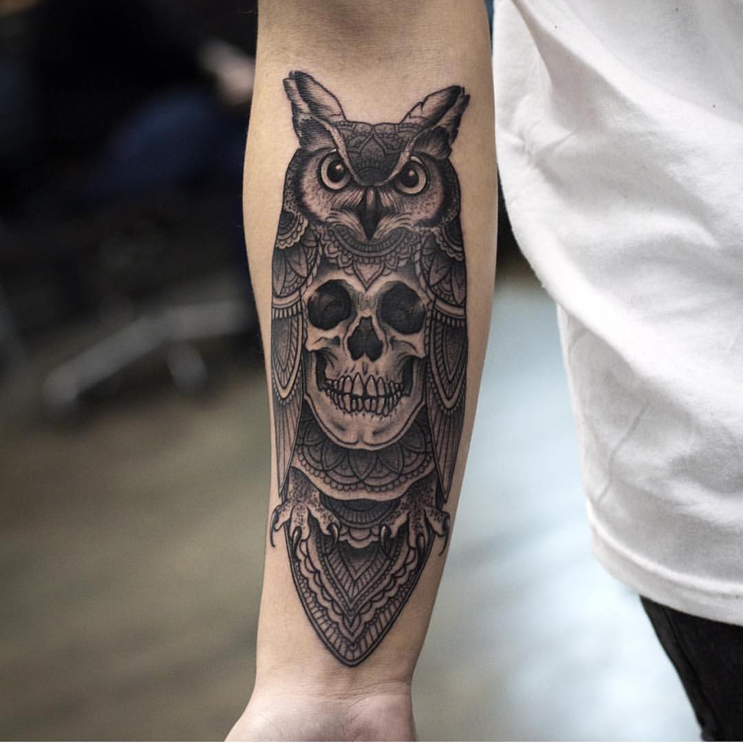 the owl tattoo with a skuul instead of its body