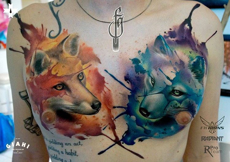 two foxes tattoo on chest
