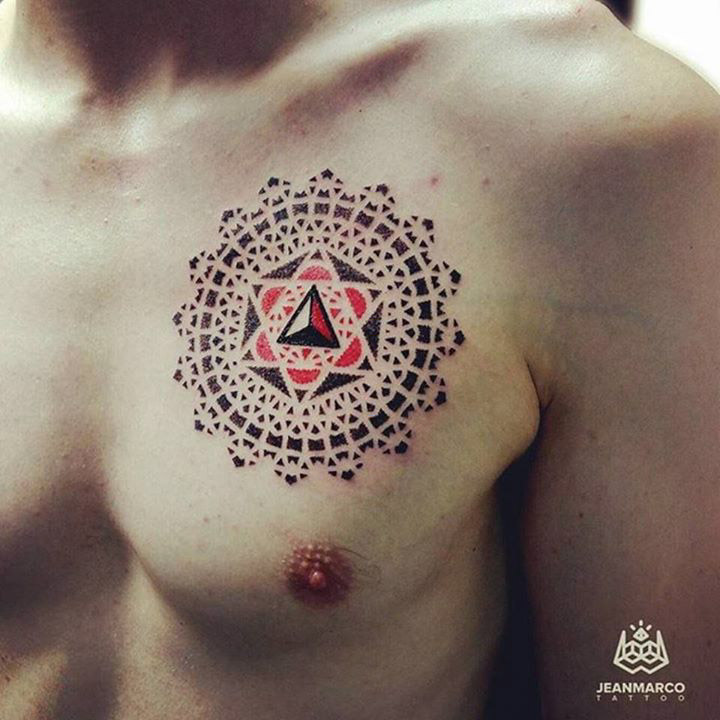 red and black dotwork mandala tattoo on chest