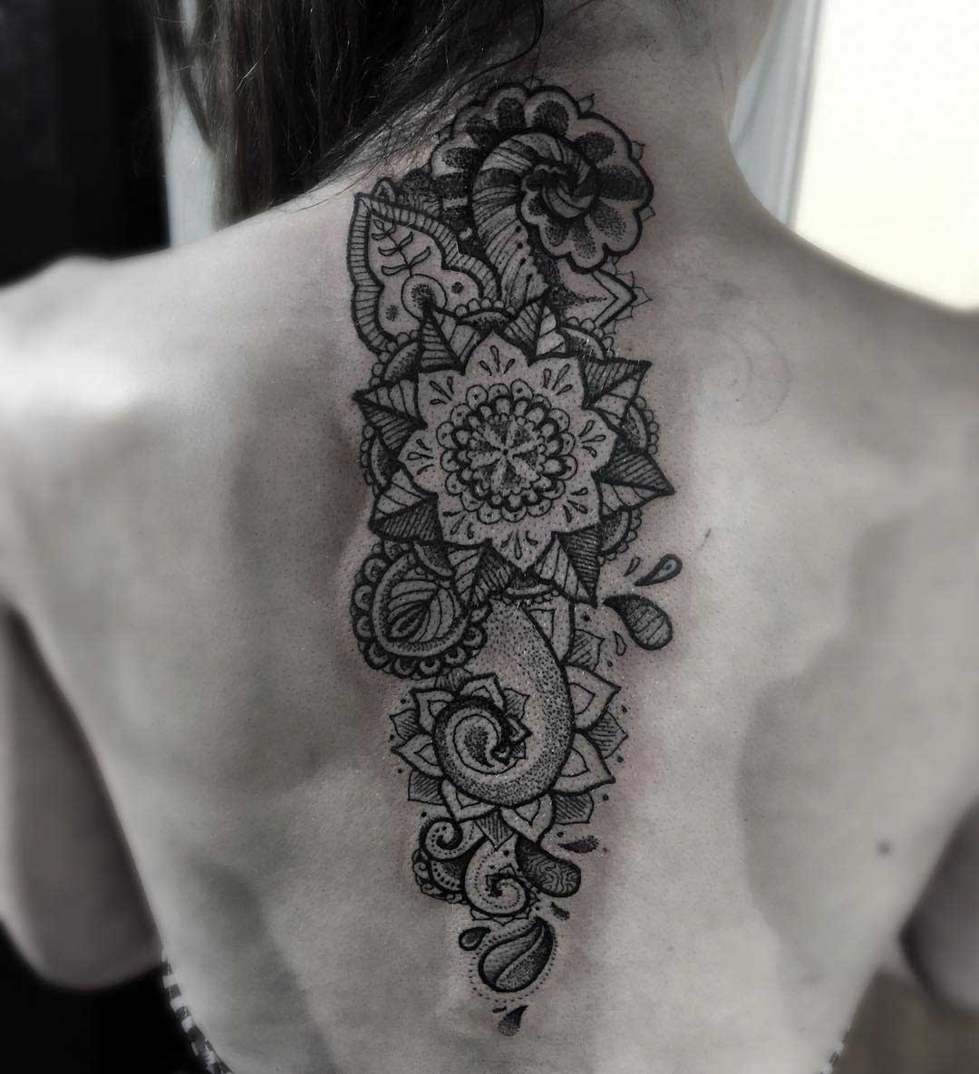 ornamental tattoo on spine