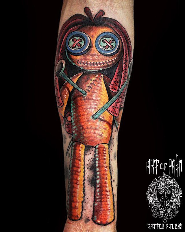 a tattoo of the Voodoo Doll on arm in theh style of Nine cartoon