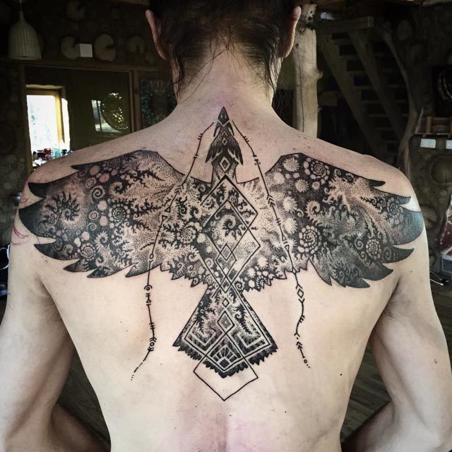 Phoenix tattoo on upper back