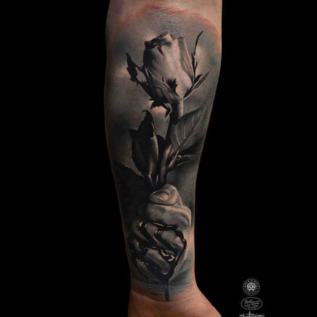 3D rose tattoo on arm
