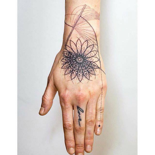 wrist and hand tattoo