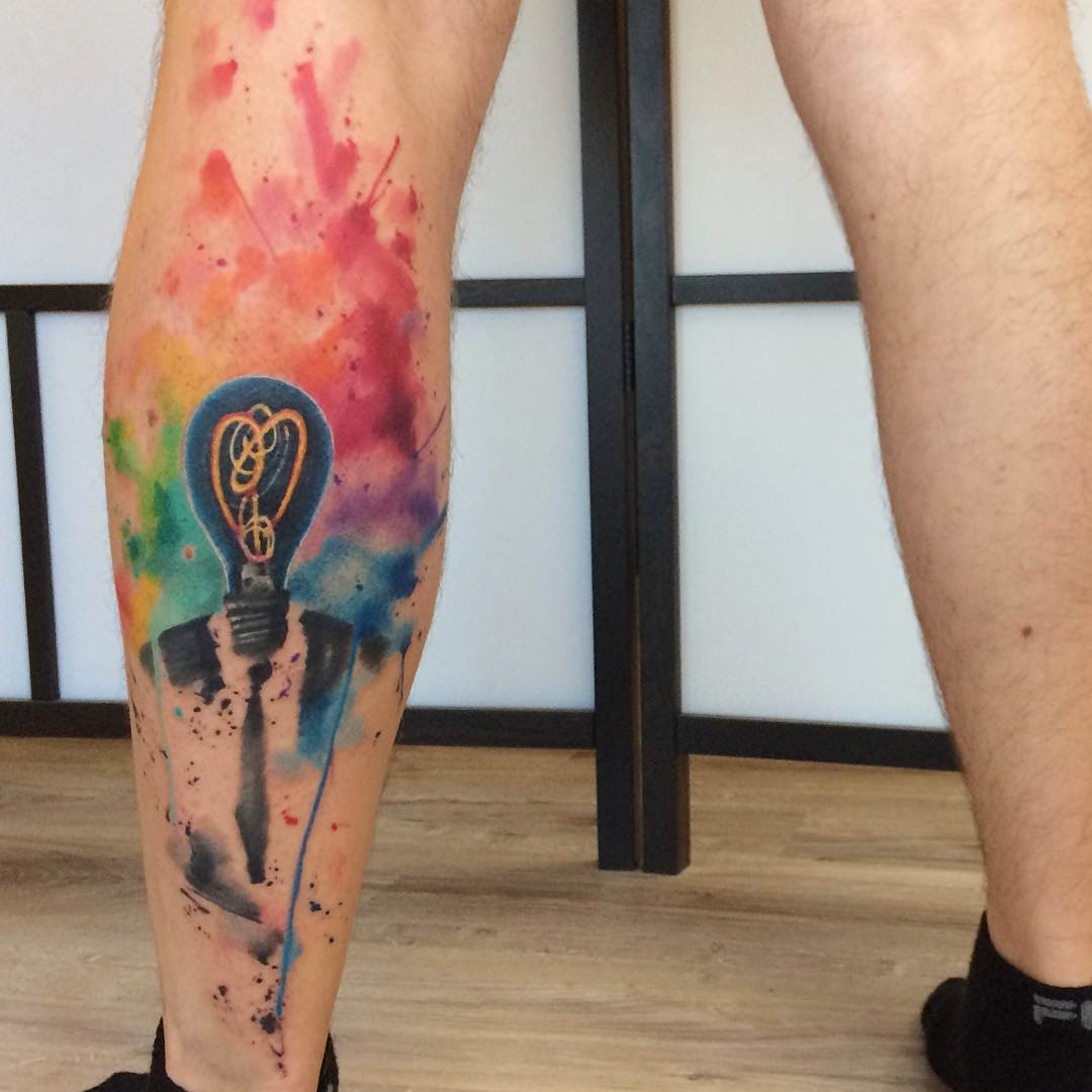watercolor leg tattoo