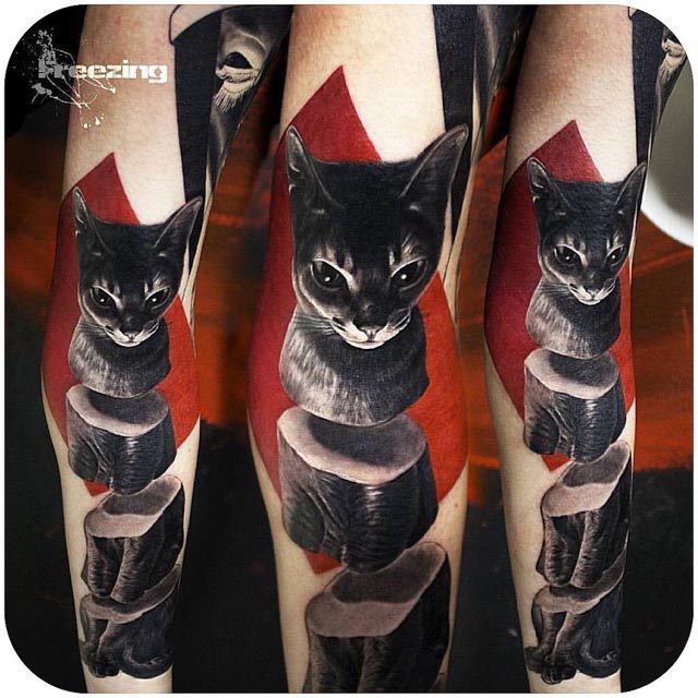 black cat tattoo on arm sliced