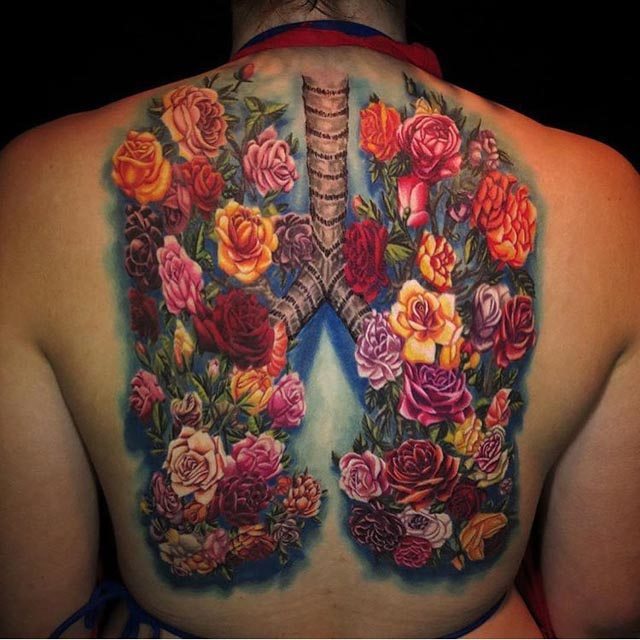 flowers tattoo on back lungs tattoo