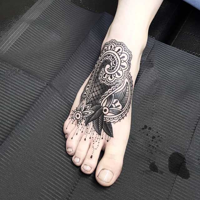 ornament tattoo on foot