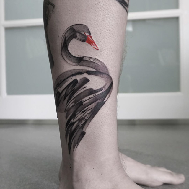 Swan tattoo on leg