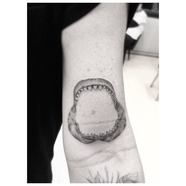 jaws of shark tattoo on arm