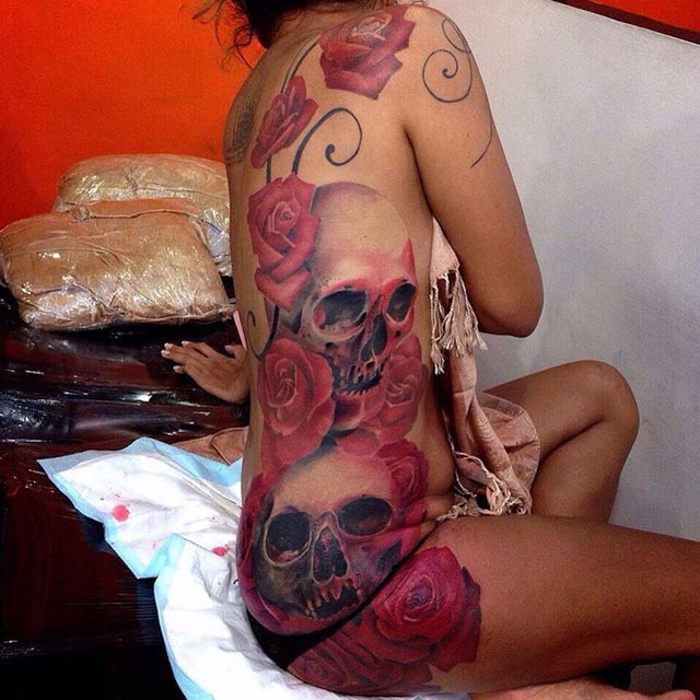 girl side tattoo skulls and roses