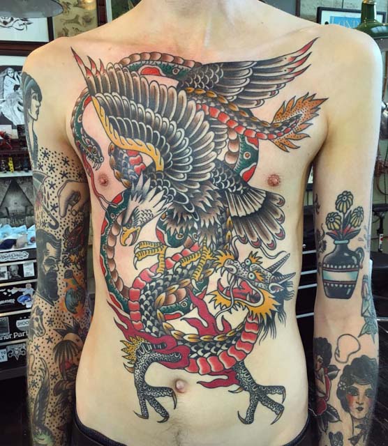 fight tattoo of dragon and eagle