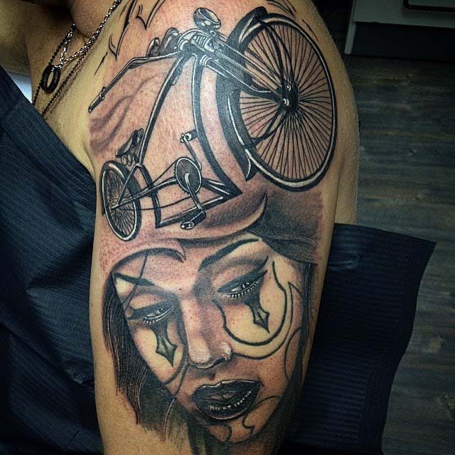 bike and lady Chicano tattoo on shoulder