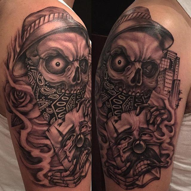 skull chicano tattoo on shoulder