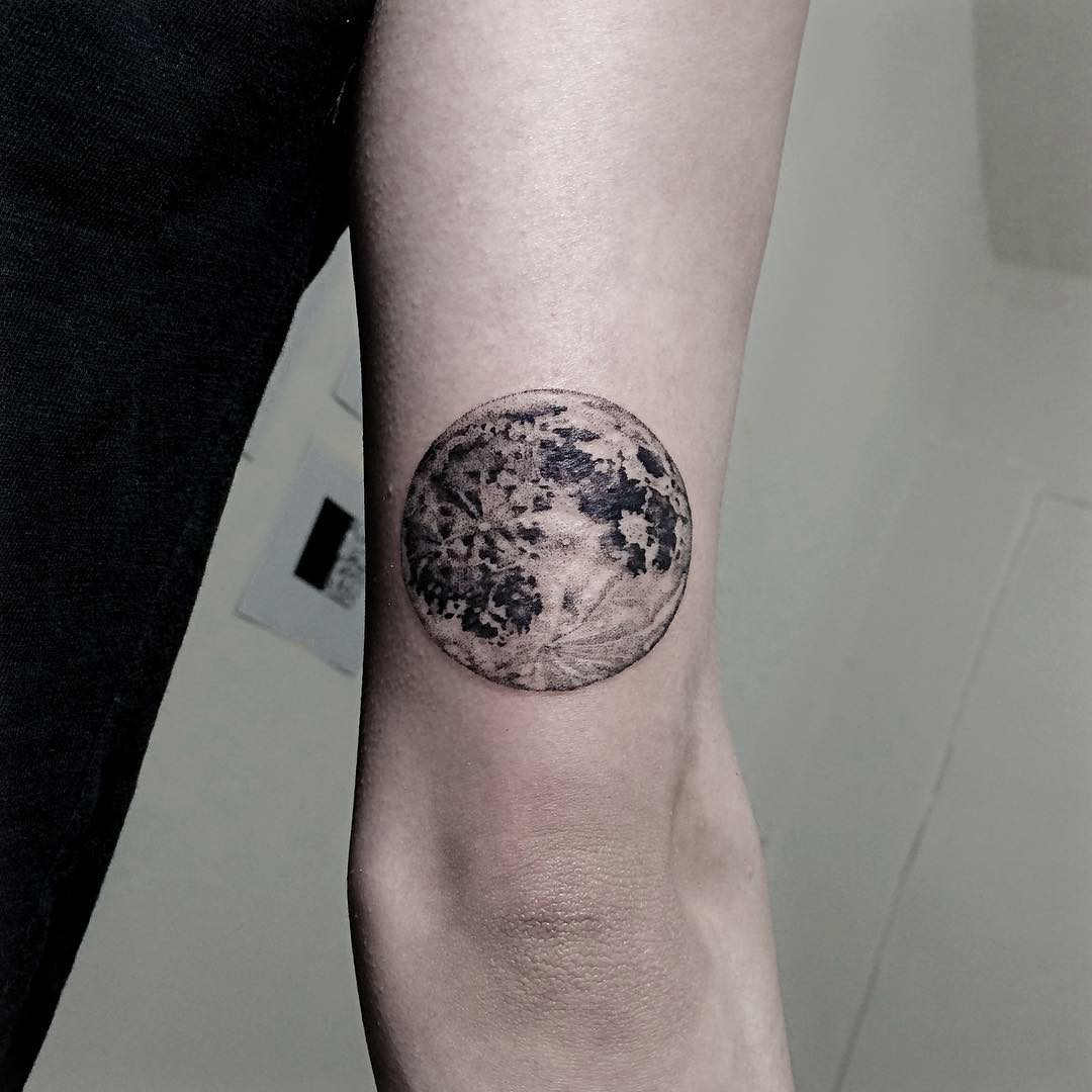full moon tattoo on arm
