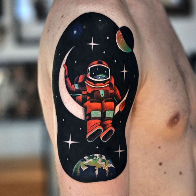 astronaut tattoo on shoulder