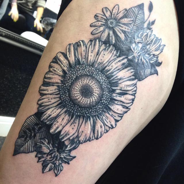 sunflower tattoo on shoulder with blue inks