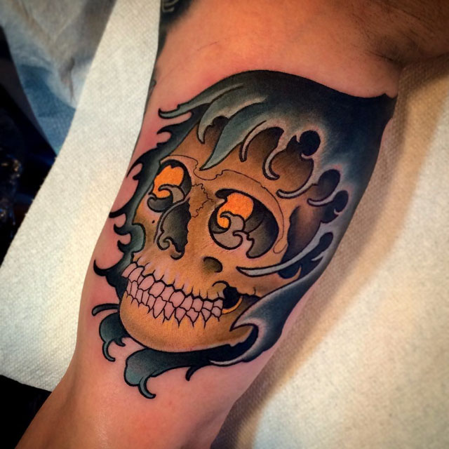 wave hood skull tattoo on arm