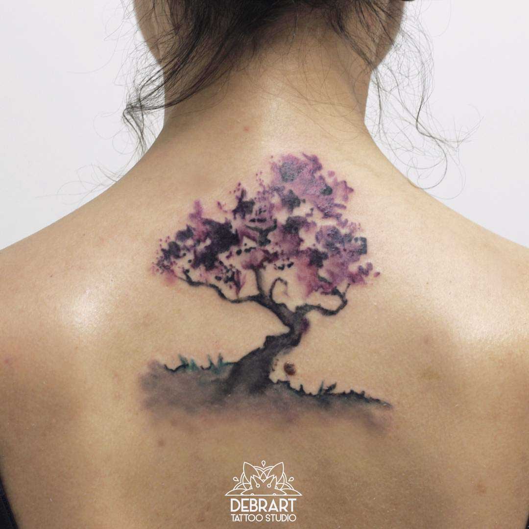 Tree tattoo on back watercolor tattoo style
