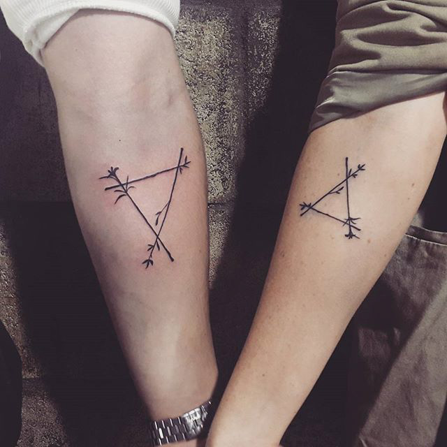geometrical matching couple tattoos