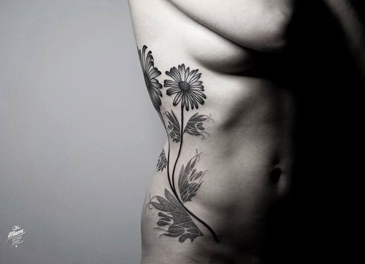 side tattoo flower chamomile