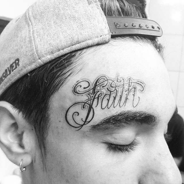 Lettering Chicano Tattoo on Forehead