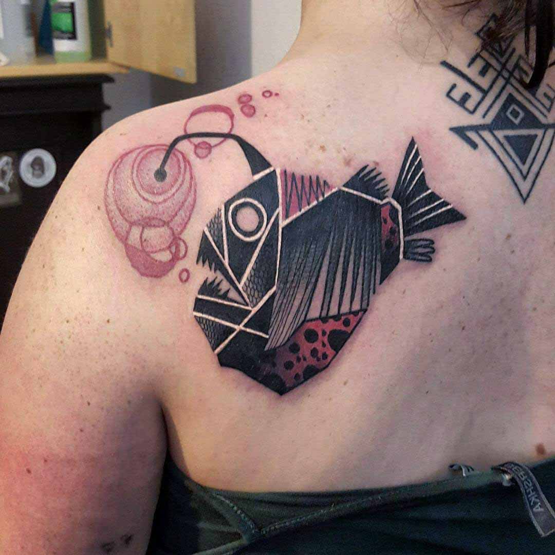 shoulder blade sea devil tattoo