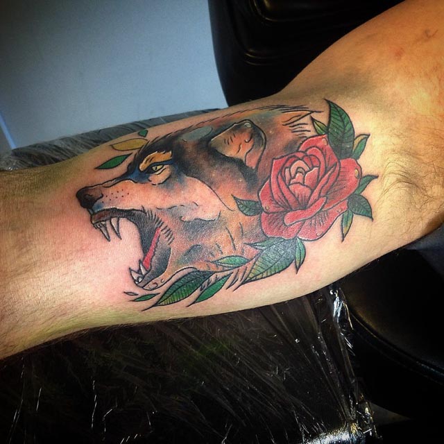 Wolf and Rose Tattoo on Bicep