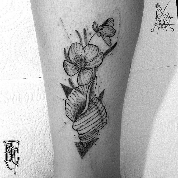 flower and shell dotwork tattoo