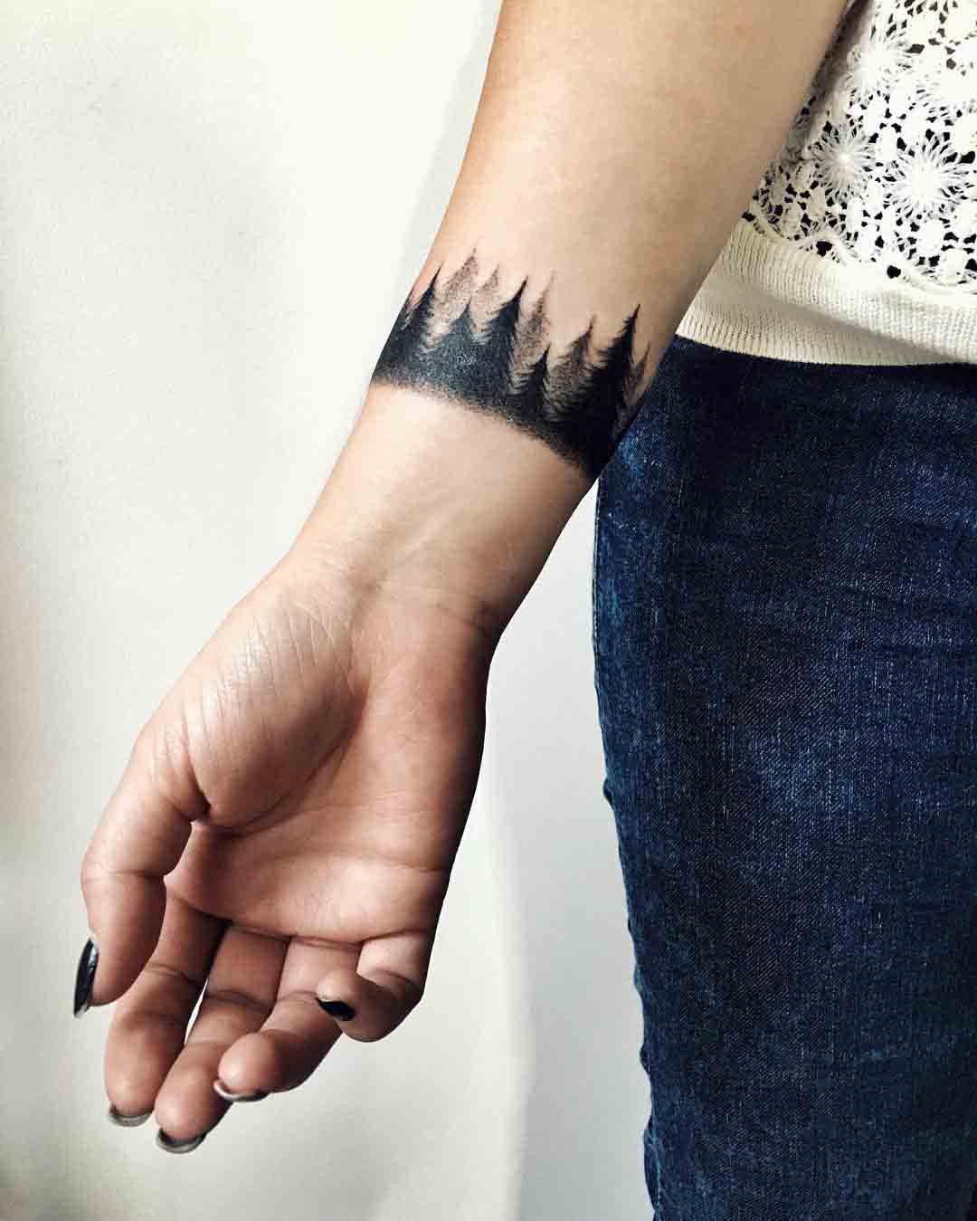 wrist tattoo forest