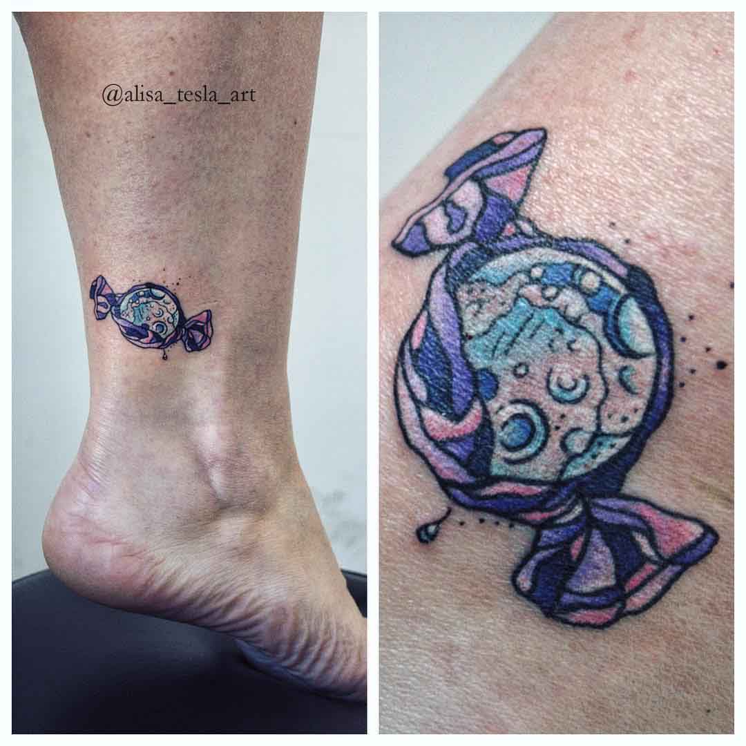 candy planet tattoo on ankle