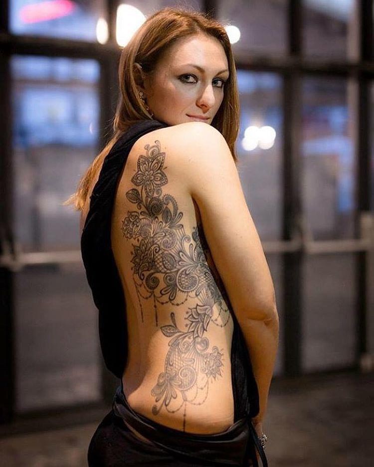 girl tattoo flowers on side