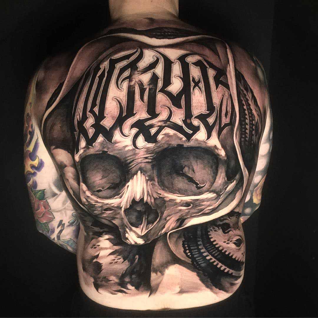 skull tattoo on back chicano style